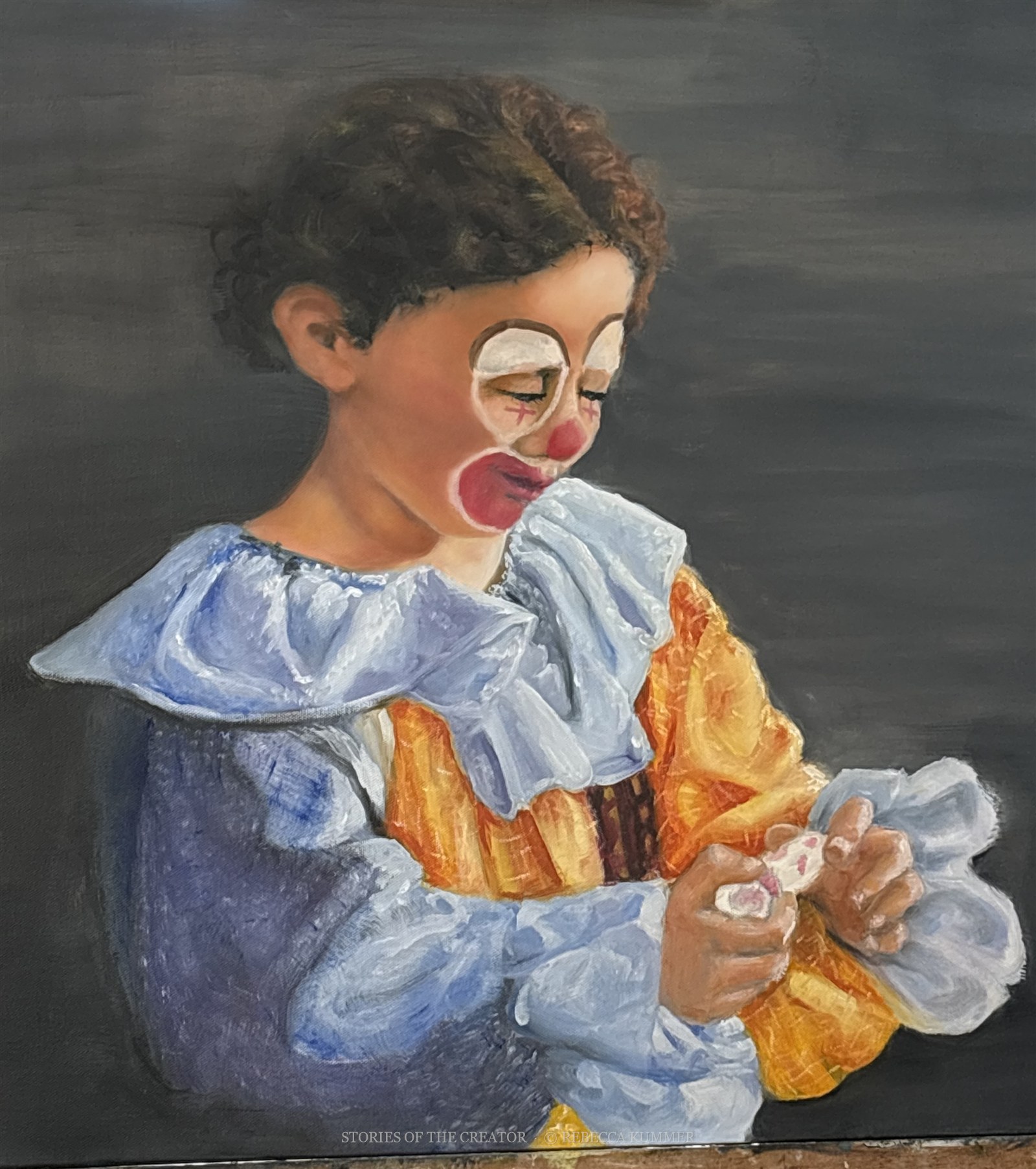 Oil portrait of a child in a blue and gold clown costume looking down at their hands